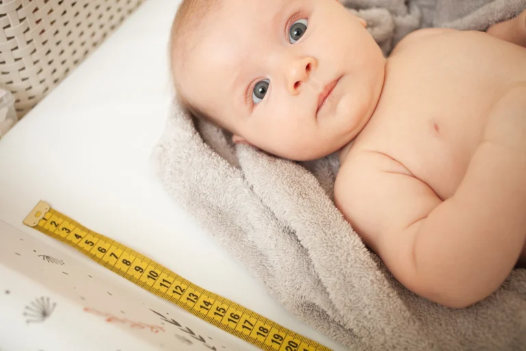 mother measuresh the growth of child, captive table, medical examination. Development, height